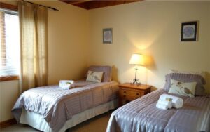 Sanctuary Lodge room with two twin beds